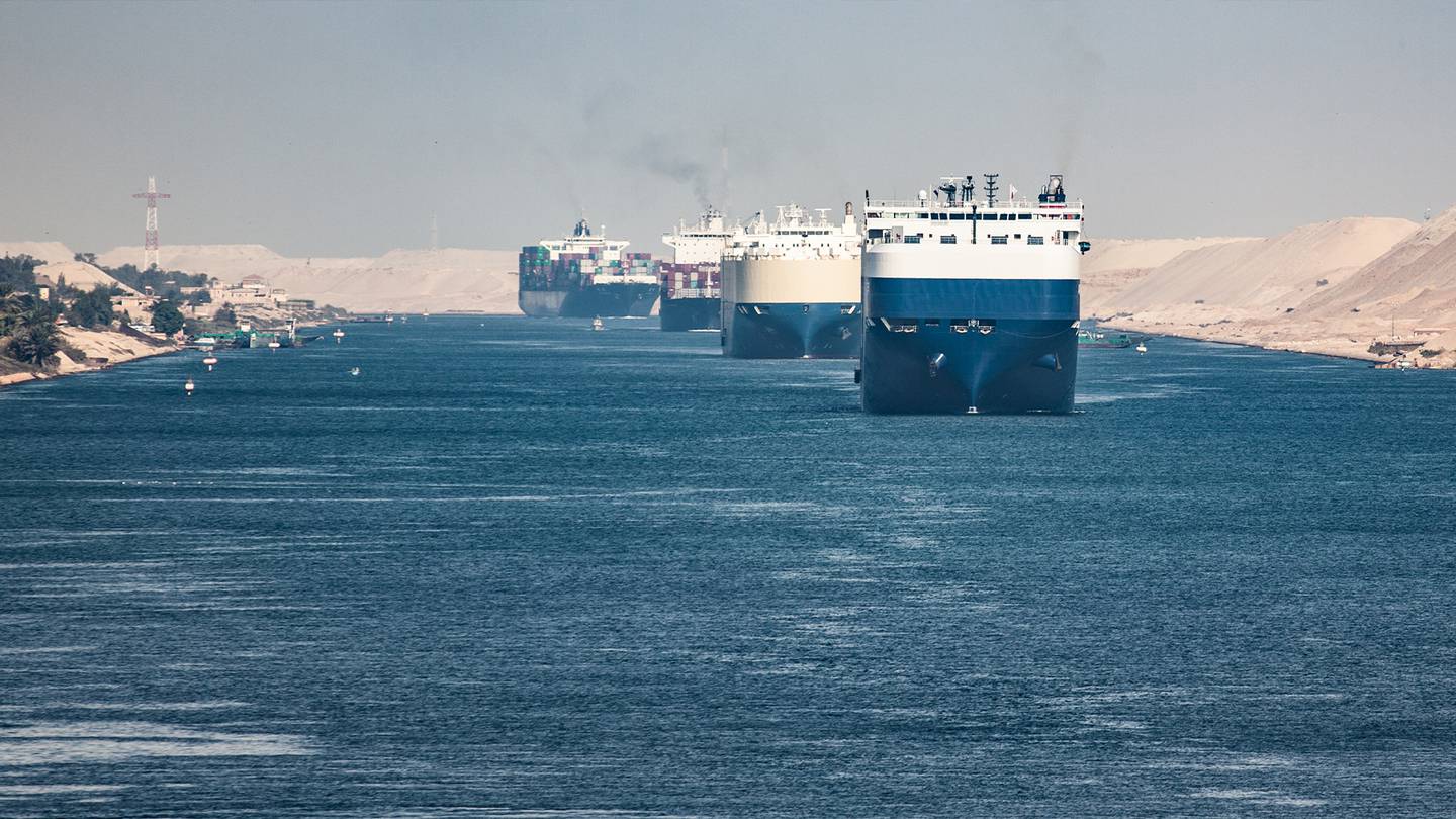 Cargo ships pass through Suez Canal