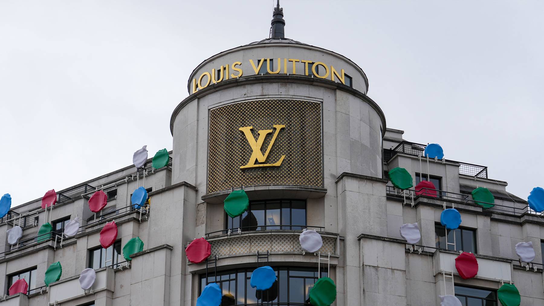 A Yayoi Kusama sculpture is displayed on the top of the Louis Vuitton's Champs Elysees store.