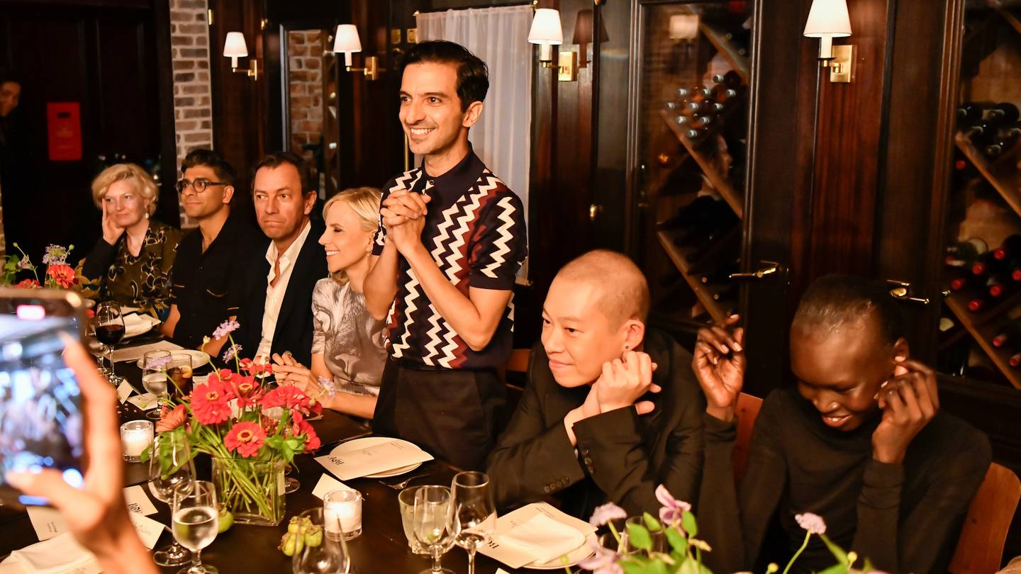 Guests seated at a table for the BoF x Shop With Google dinner during New York Fashion Week SS24. From left: Rachel Tashjian, Rahul Malik, Pierre-Yves Roussel, Tory Burch, Imran Amed, Jason Wu and Alek Wek.