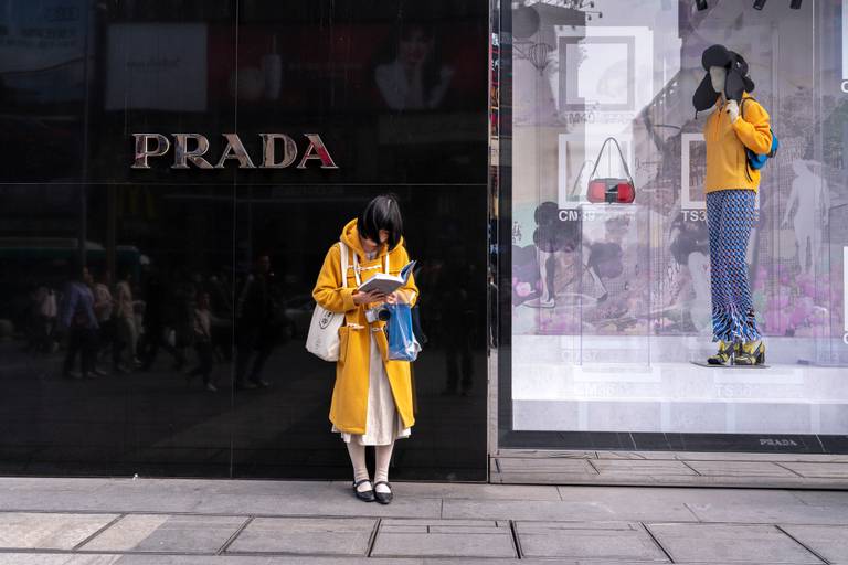 A luxury shopper outside a Prada store in Chengdu
