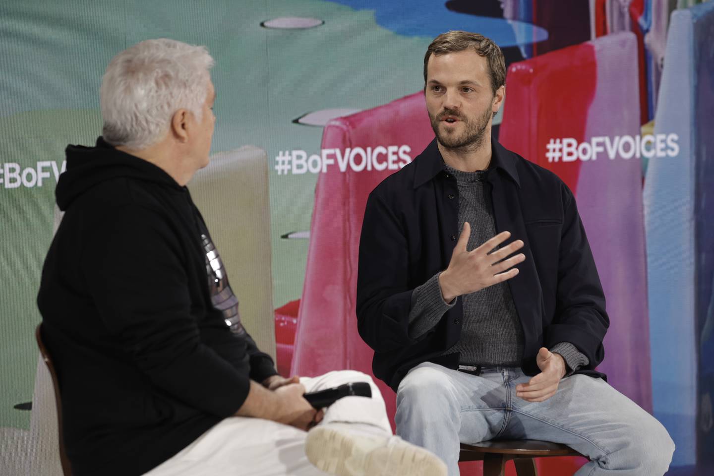 Tim Blanks and Matthieu Blazy onstage during #BoFVOICES at Soho Farmhouse on November 29, 2023 in Chipping Norton, England.
