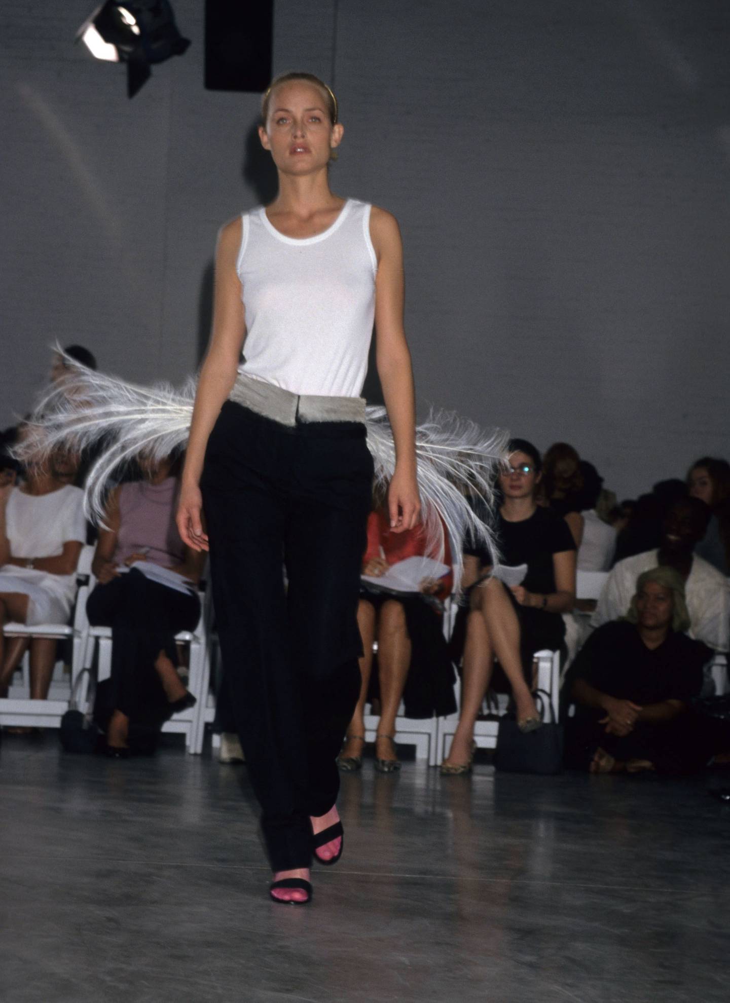 Model Amber Valletta walks the Helmut Lang show in 1998.