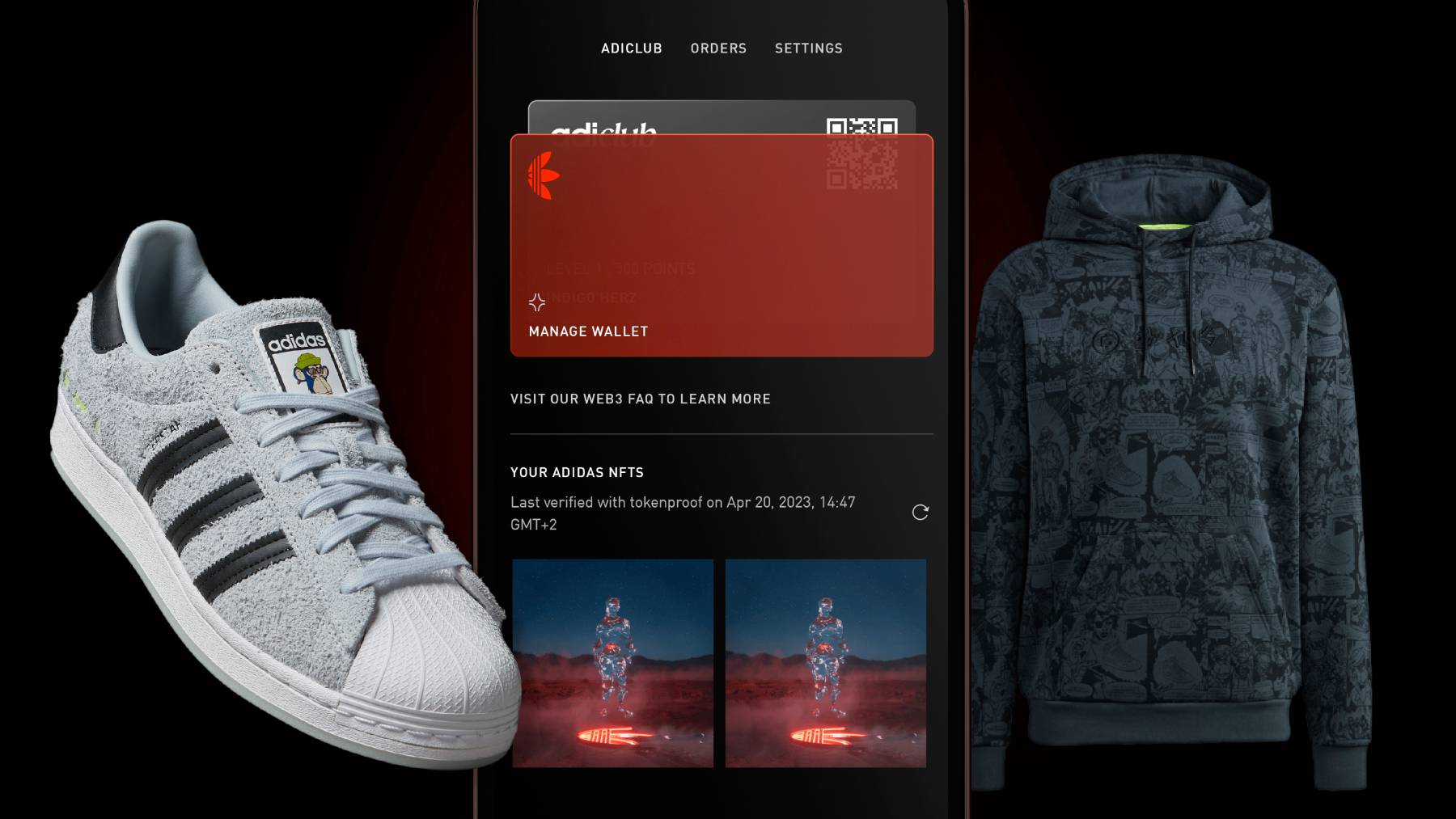 An Adidas Superstar sneaker and special collaboration hoodie float on either side of the brand's Confirmed app, which displays two Adidas NFTs.