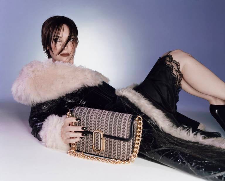 Longtime Marc Jacobs muse Winona Ryder in a 2022 campaign featuring one of the brand's newest handbags.