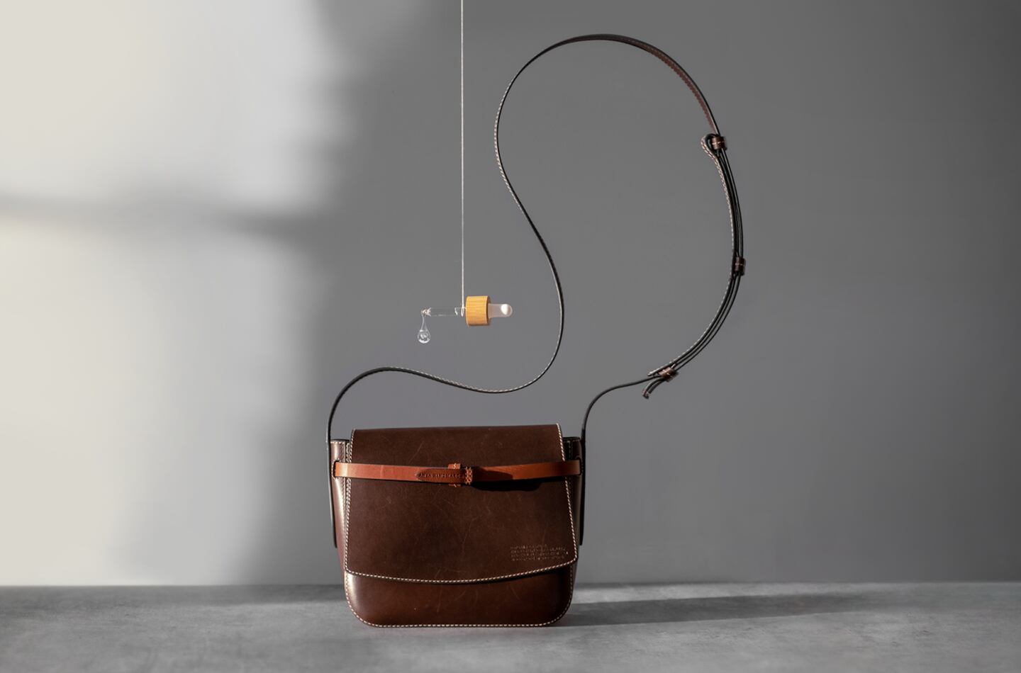 A leather handbag by Anya Hindmarch that uses Evolved By Nature's silk-based coating