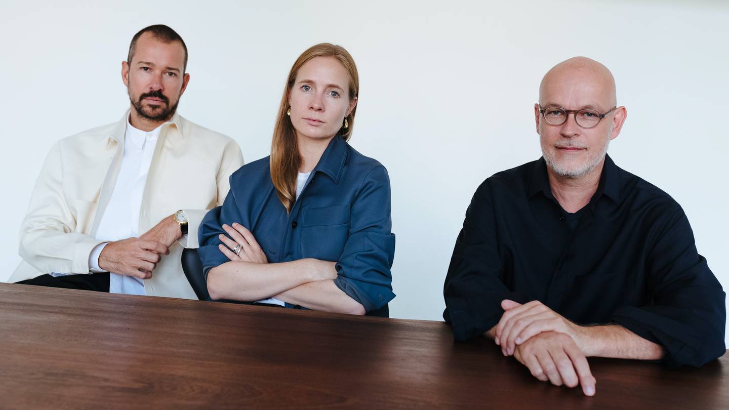 Jil Sander's designers Luke and Lucie Meier and Chief Executive Axel Keller.
