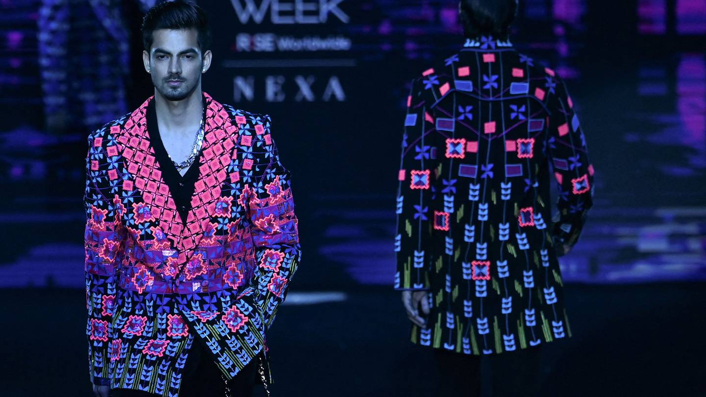 Models present creations by designer Manish Malhotra during a fashion show at the FDCI x Lakme Fashion Week in New Delhi.