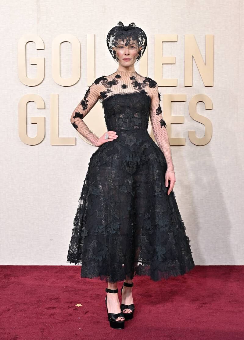 Rosamund Pike attends the 81st Annual Golden Globe Awards wearing Dior.