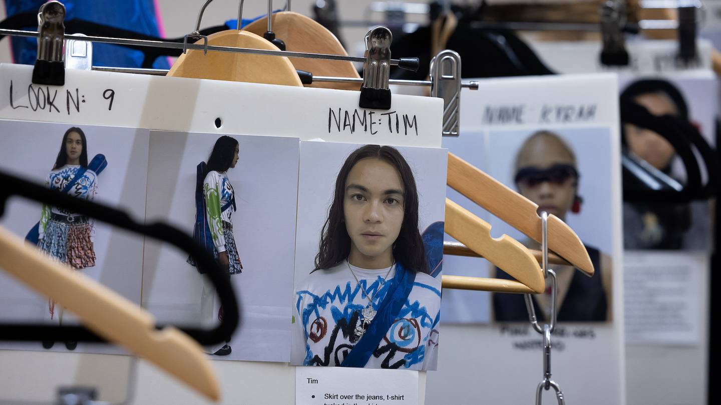 Images and headshots of models in their looks clipped to clothes rail and hangers ahead of the Chopova Lowena show during London Fashion Week September 2022.