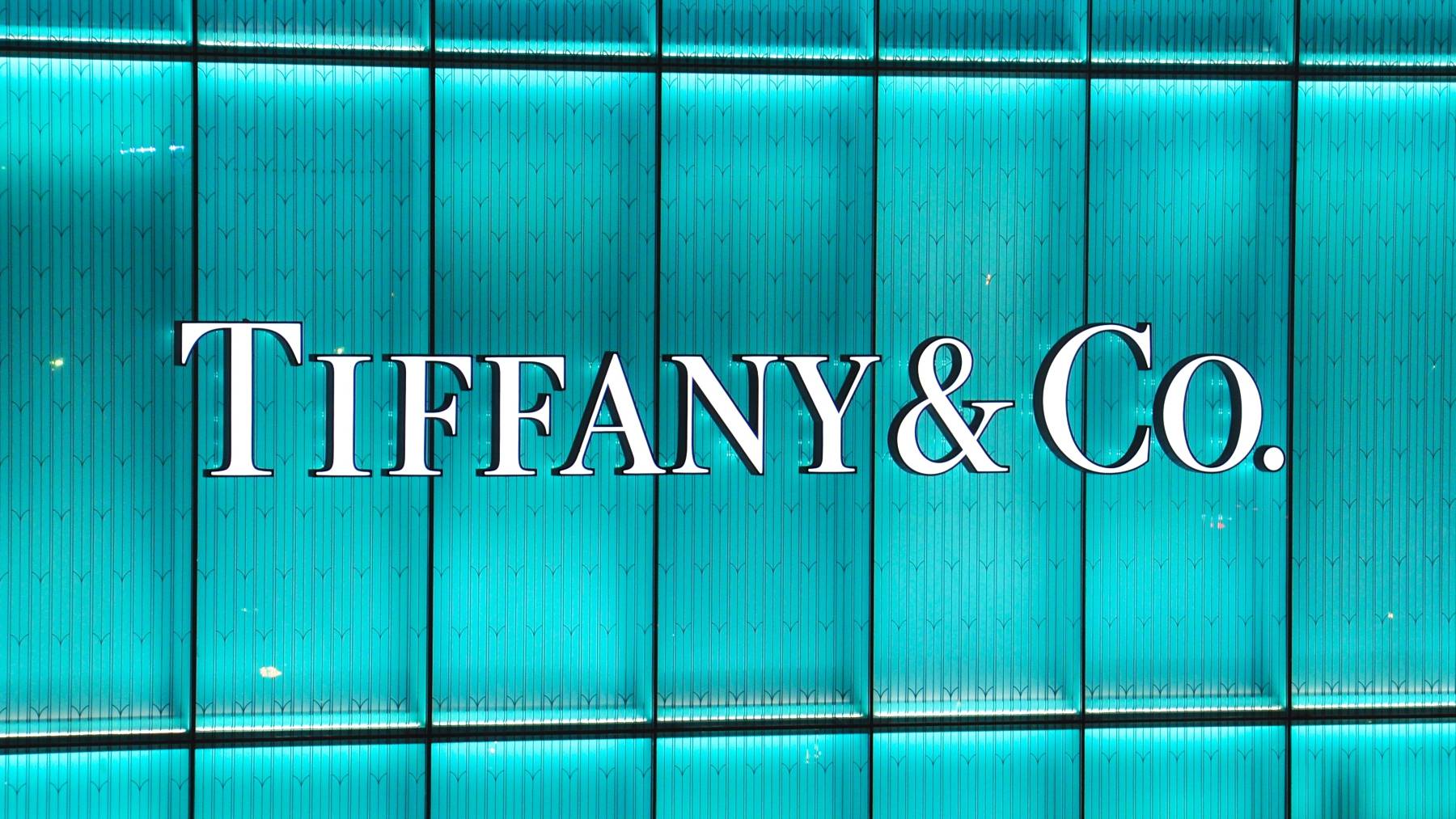 The Tiffany logo against a background in the company's signature blue.