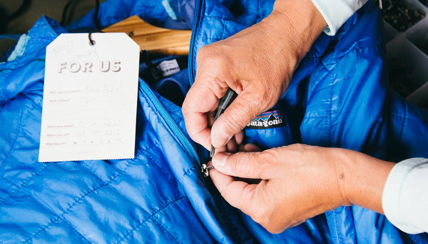 Someone is fixing a Patagonia jacket.