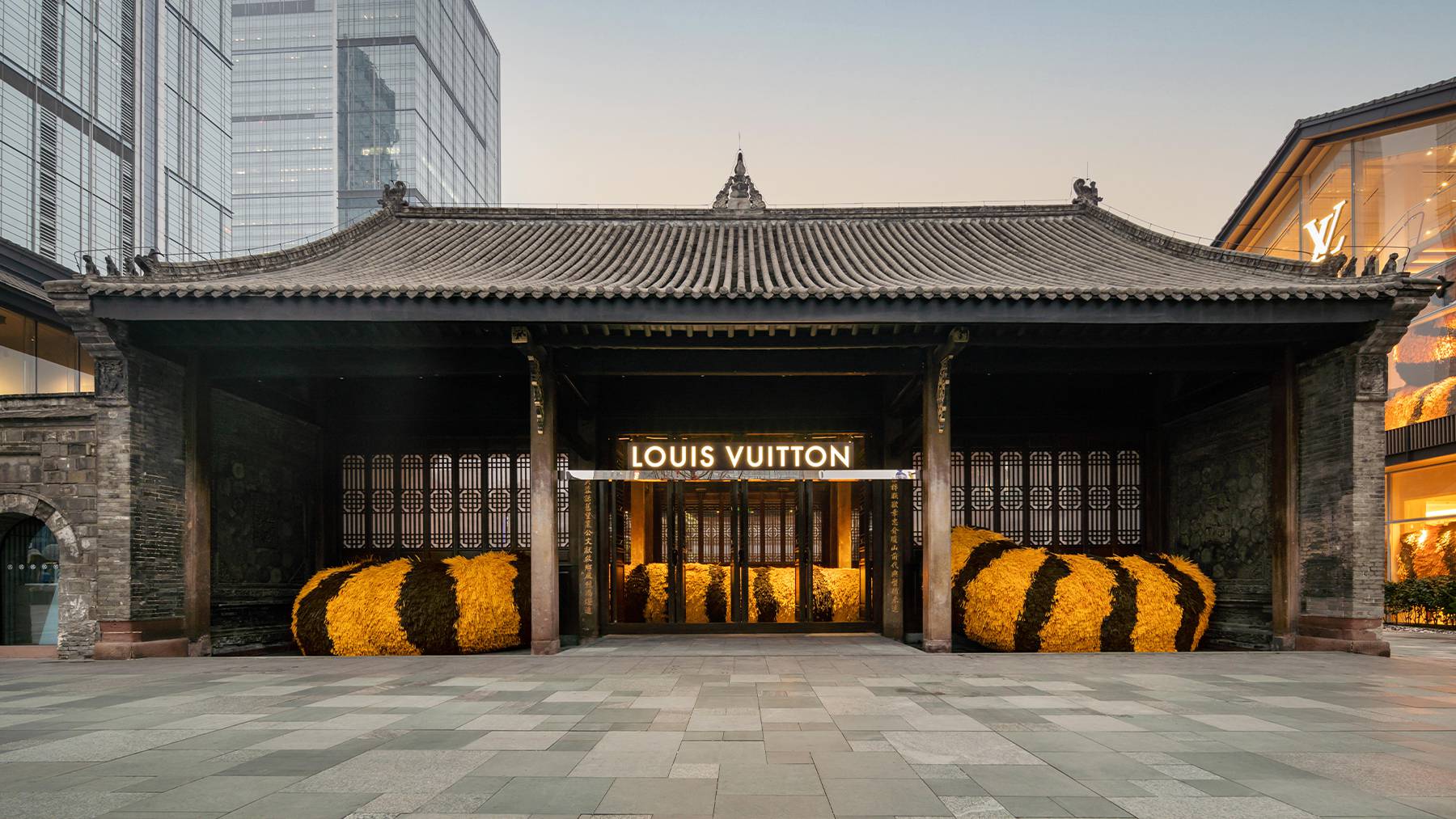 Chengdu Louis Vuitton boutique with a tigers tail made out of flowers weaving through the store exterior.