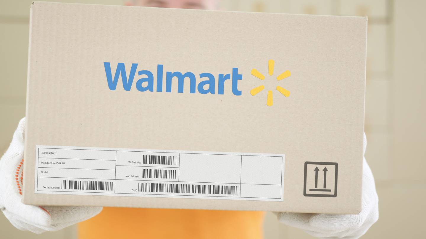 Walmart delivery parcel with the logo and barcodes on the front of the cardboard package.