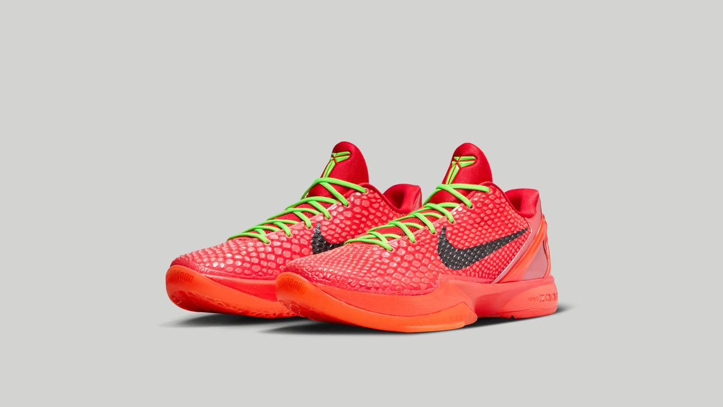 The low-top basketball shoe has a scaly upper in honor of Kobe's nickname, Black Mamba, and comes in a bright red colourway with neon green laces.