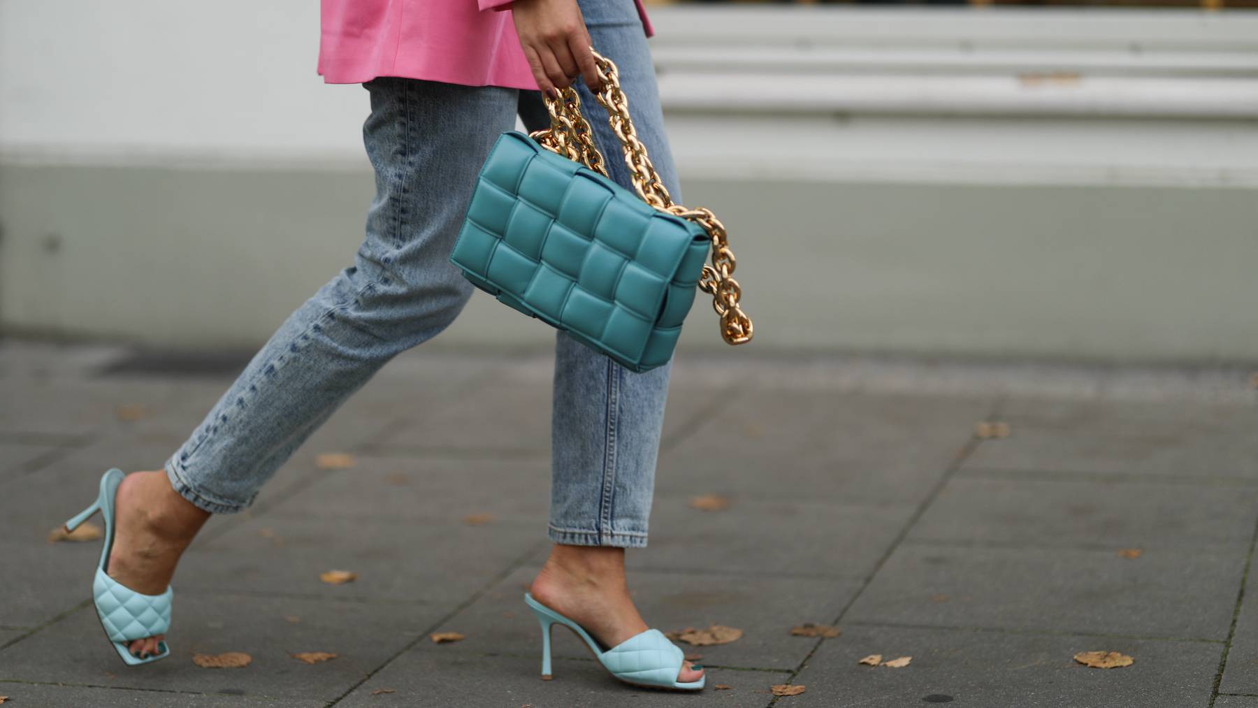 A fashion week attendee wears Bottega Veneta shoes and a handbag. Getty Images.