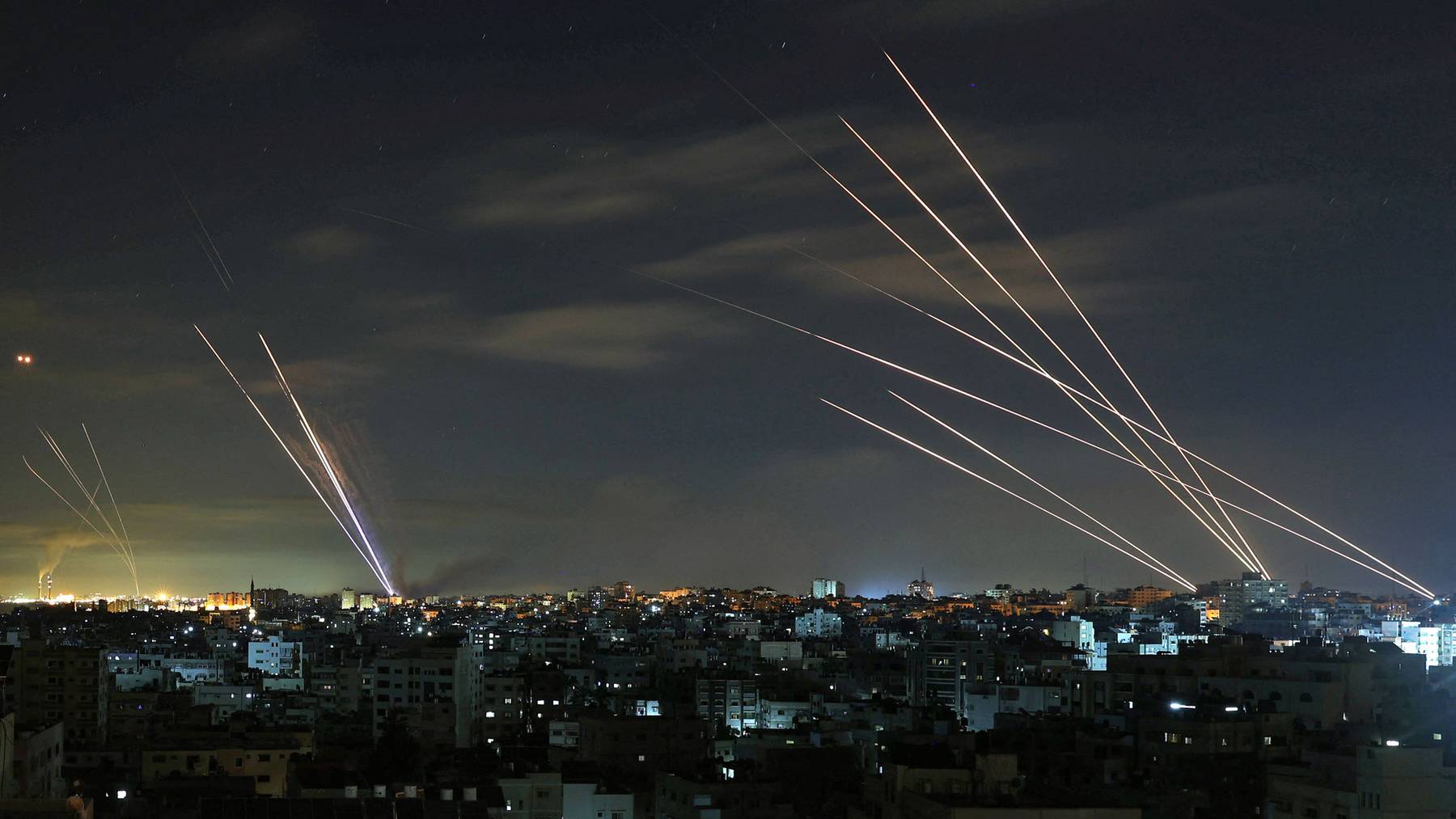 Israel's Iron Dome missile defence system intercepts rockets fired by Hamas towards Israel. Mohammed Abed/AFP via Getty Images.