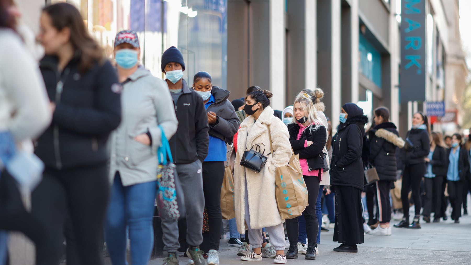 Customers queue outside a Primark store following its reopening on Oxford Street in central London. Getty Images.