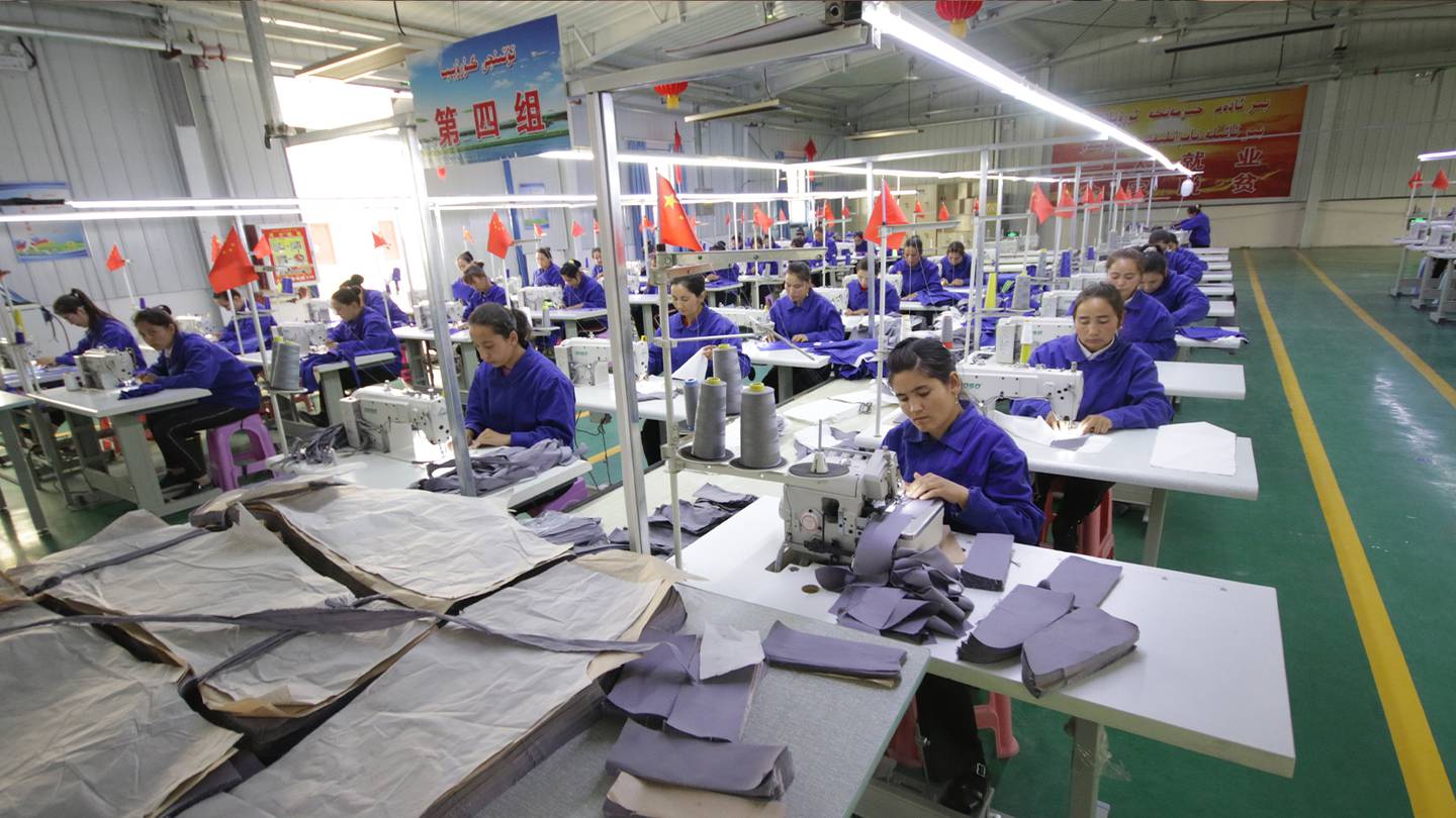 Women work in a garment factory in Hotan county, Xinjiang province, China.