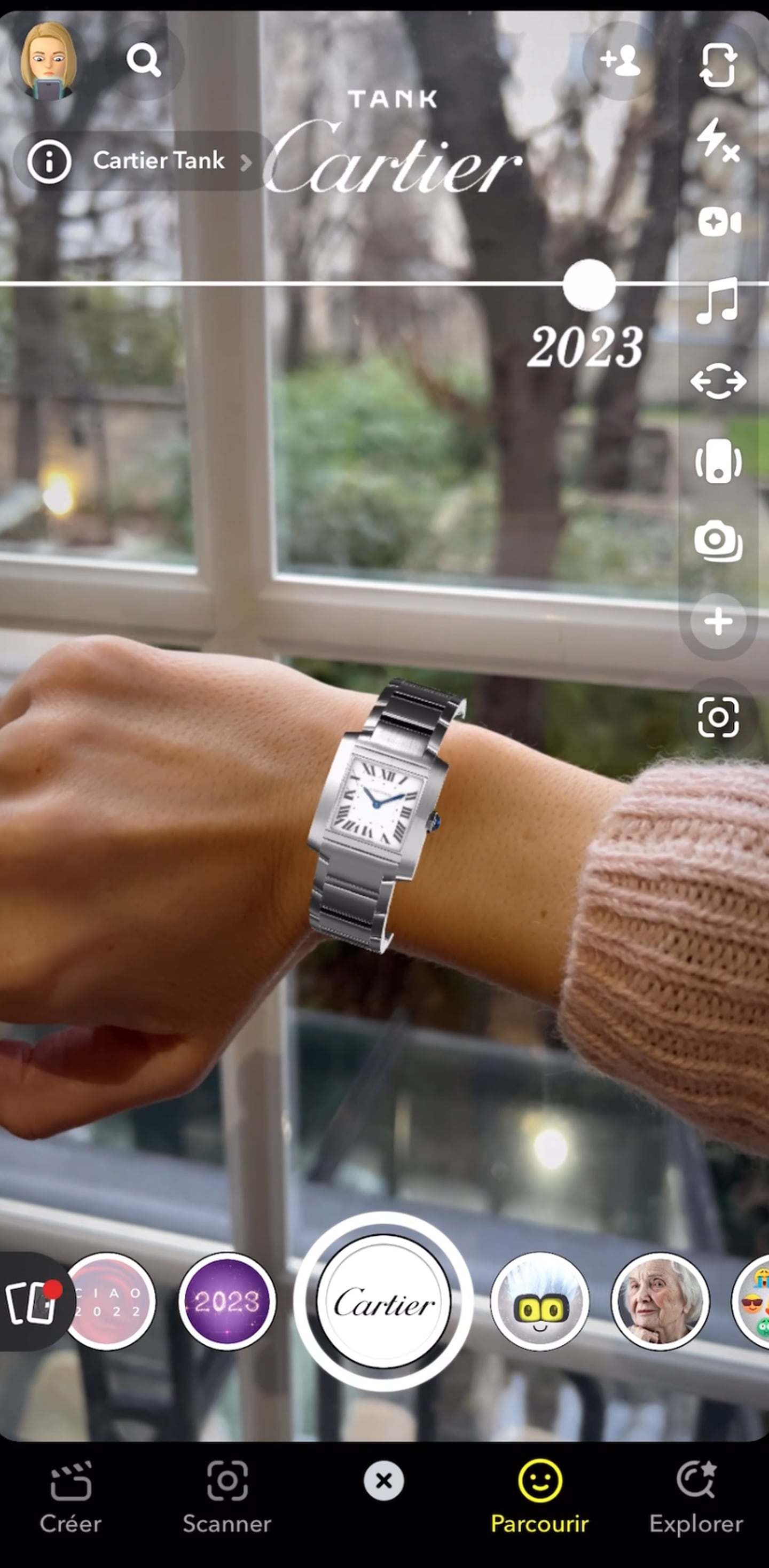 A virtual version of the Tank watch appears on a model's wrist in Snapchat.
