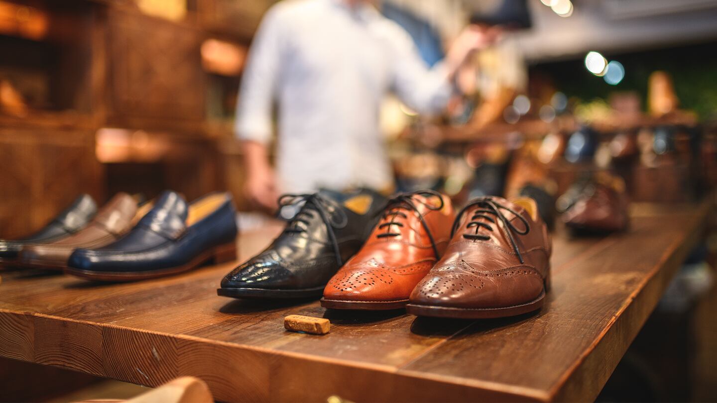 Display Of Expensive Men's Brogue Shoes In A Luxury Leather Footwear Store