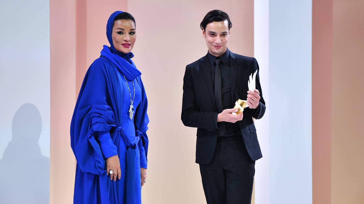 Her Highness Sheikha Moza bint Nasser and Mohamed Benchellal appear onstage at the Fashion Trust Arabia Prize Gala.
