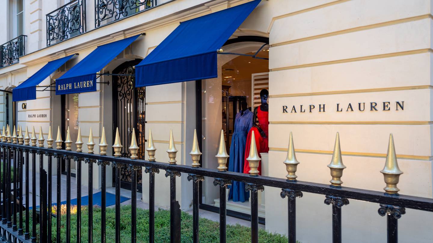 A Ralph Lauren store with a blue awning in  in the Champs-Elysees district of Paris, France.