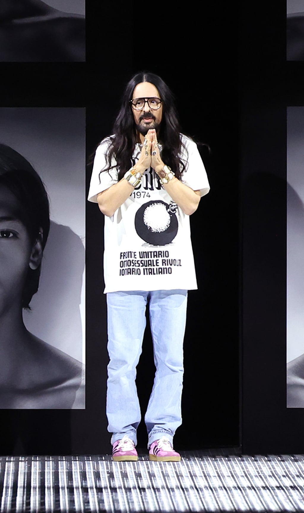 Alessandro Michele acknowledges the applause of the audience during the Gucci Twinsburg Show during Milan Fashion Week Spring/Summer 2023 in Milan.