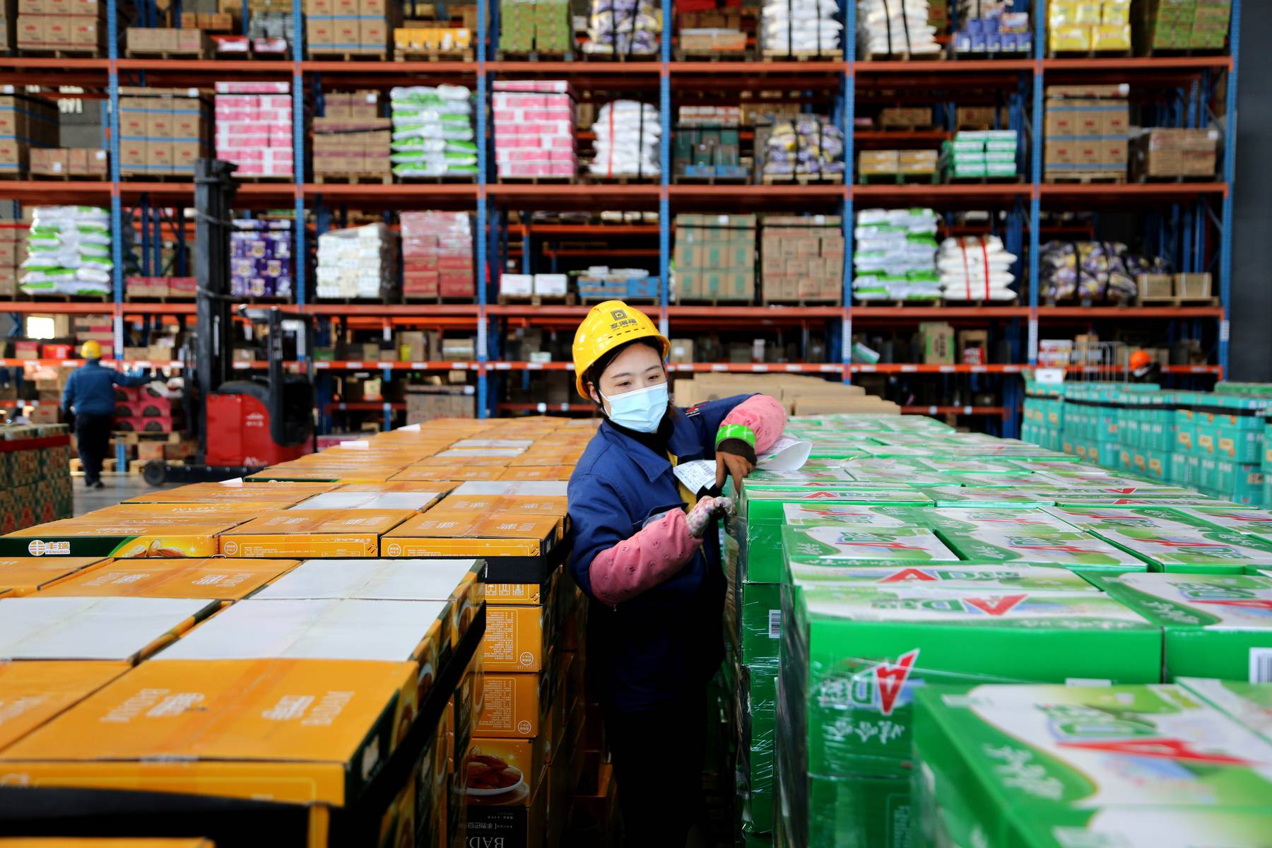 Worker at e-commerce logistics warehouse in Lianyungang City, Jiangsu Province, China. Getty Images.