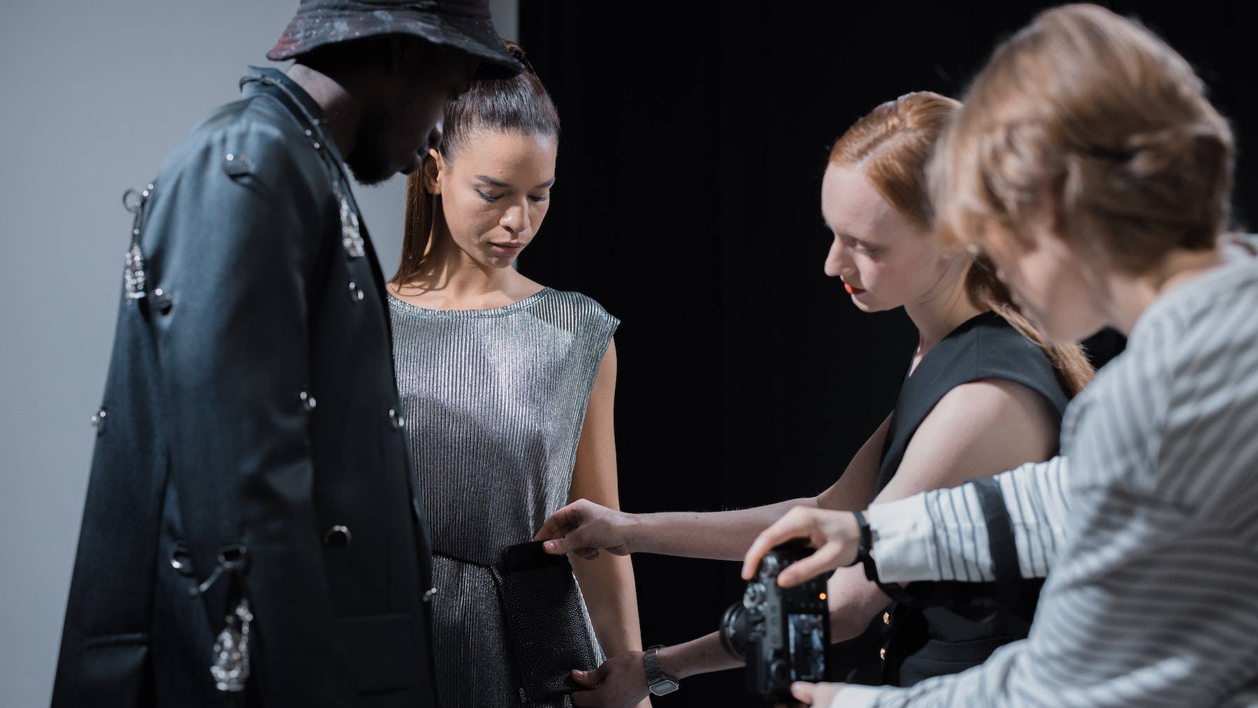 A production team working on set of a fashion photoshoot.