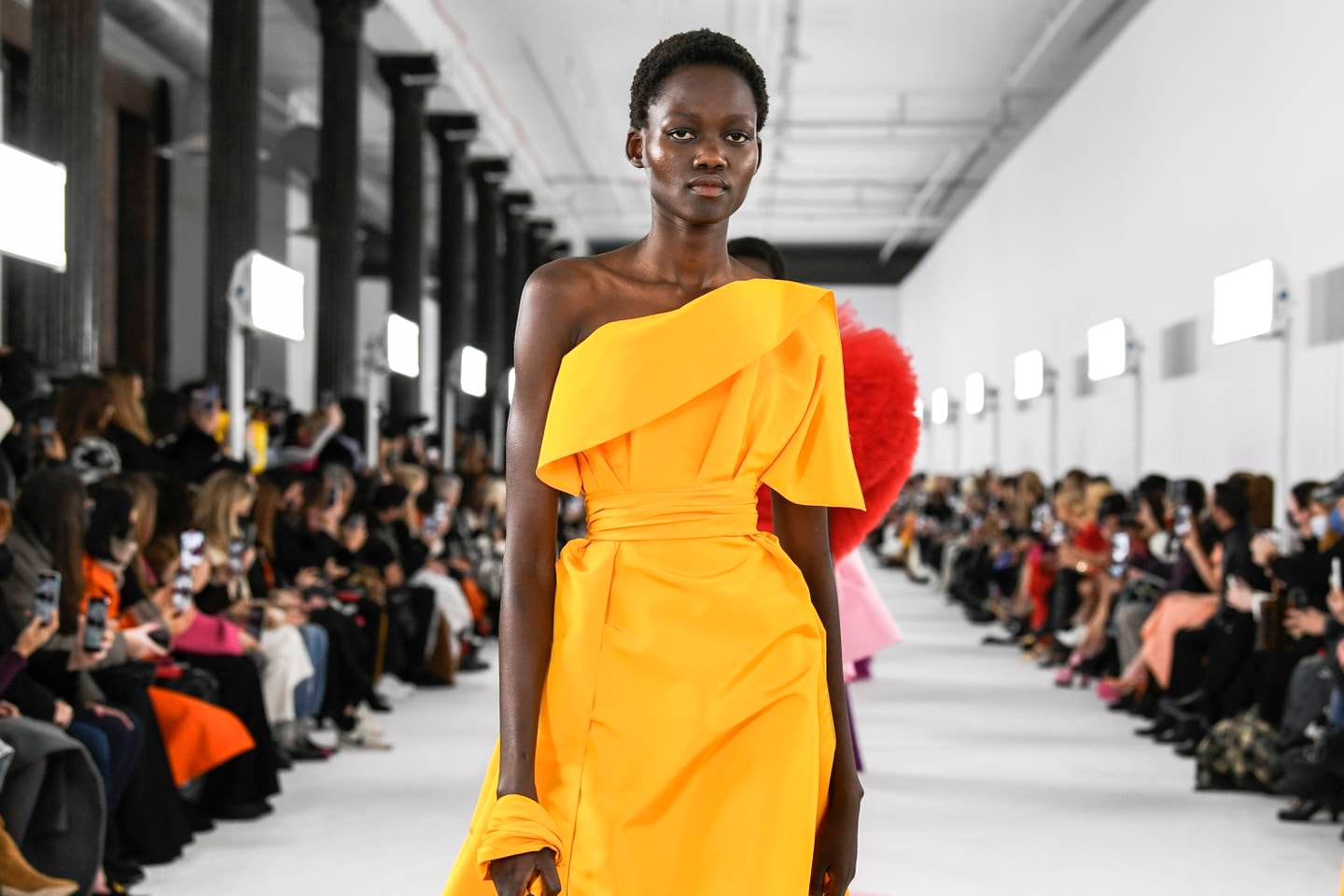 A model walks the runway at Carolina Herrera's Autumn/Winter 2022 show.