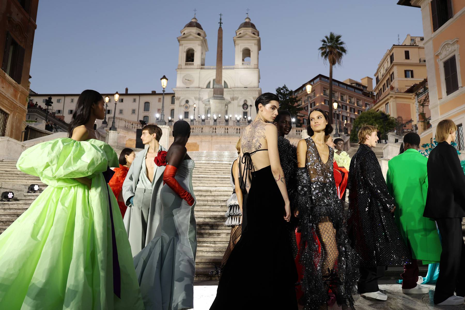 Models pose on the runway at the Valentino Haute Couture Fall/Winter 2023 show.
