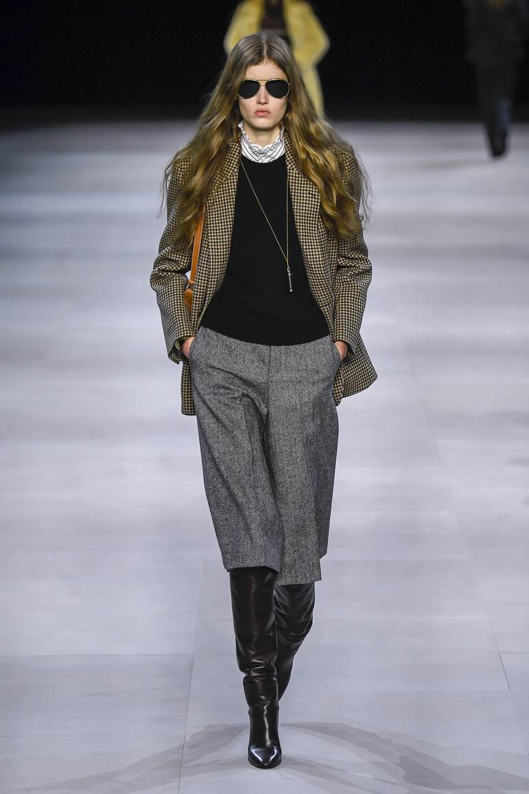 Slimane pivoted to a 70s inspired, "neo-bourgeois" aesthetic that proved influential. Indigital.