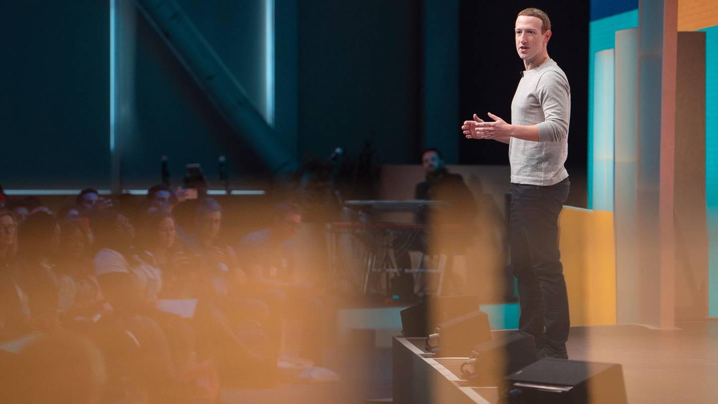 Mark Zuckerberg stands on a stage addressing an audience.