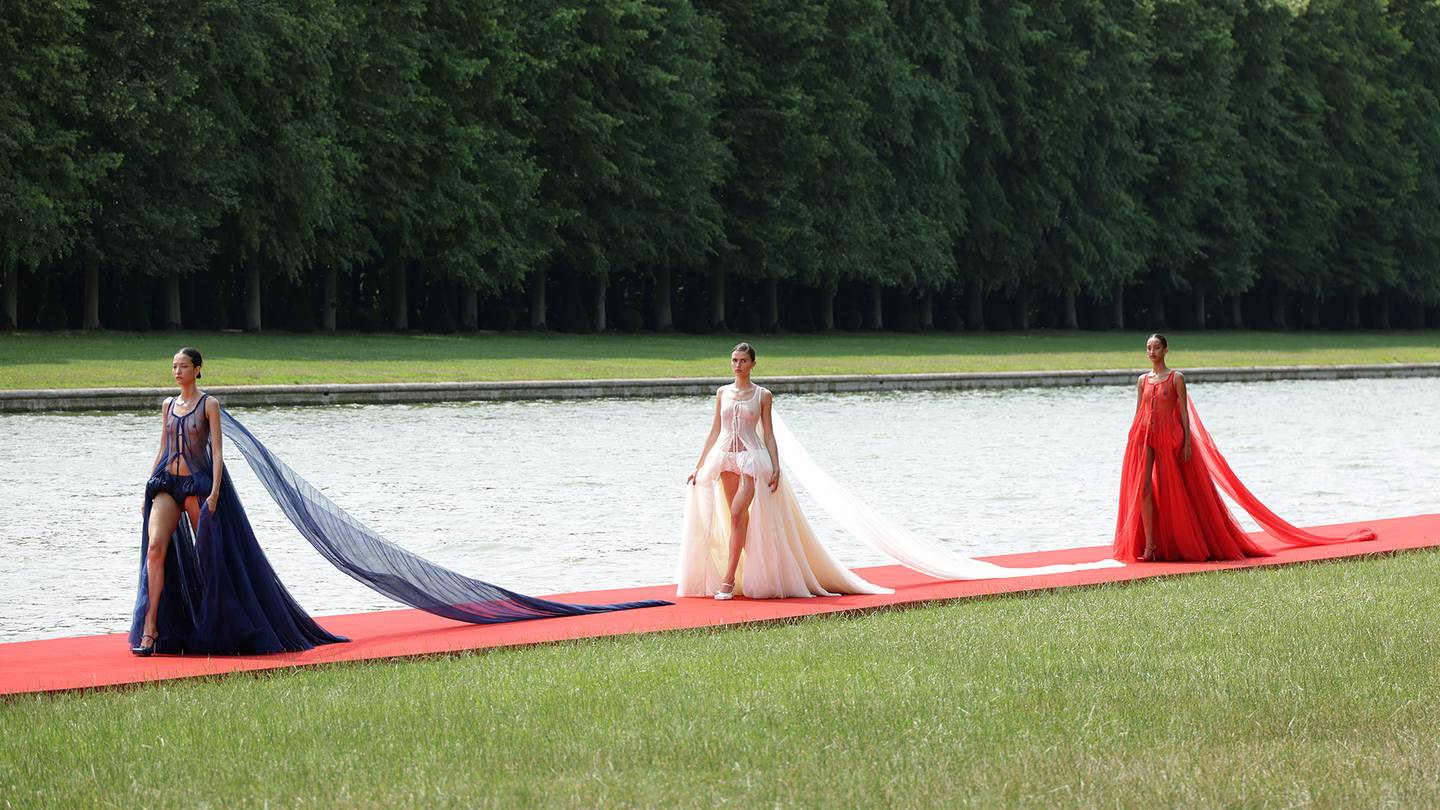Models walk the runway during "Le Chouchou" Jacquemus' Fashion Show at Chateau de Versailles.