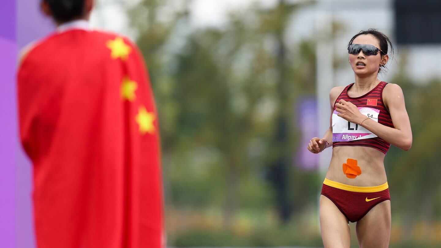 Prada has dressed Chinese athletes for a Douyin campaign, including marathon runner Li Zhixuan, seen here crossing the finishing line during the Asian Games in Oct., 2023 in Hangzhou, China.