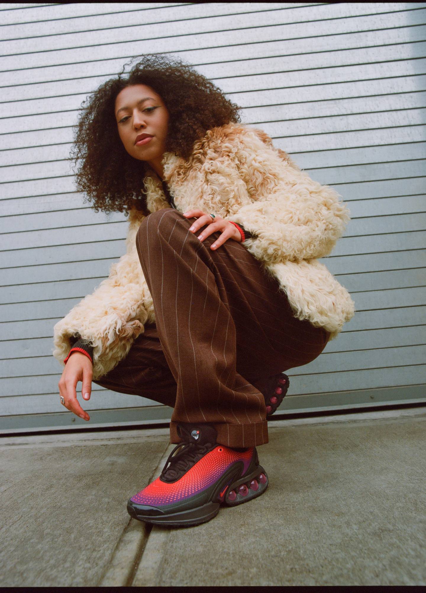 A model wears a Nike sneaker