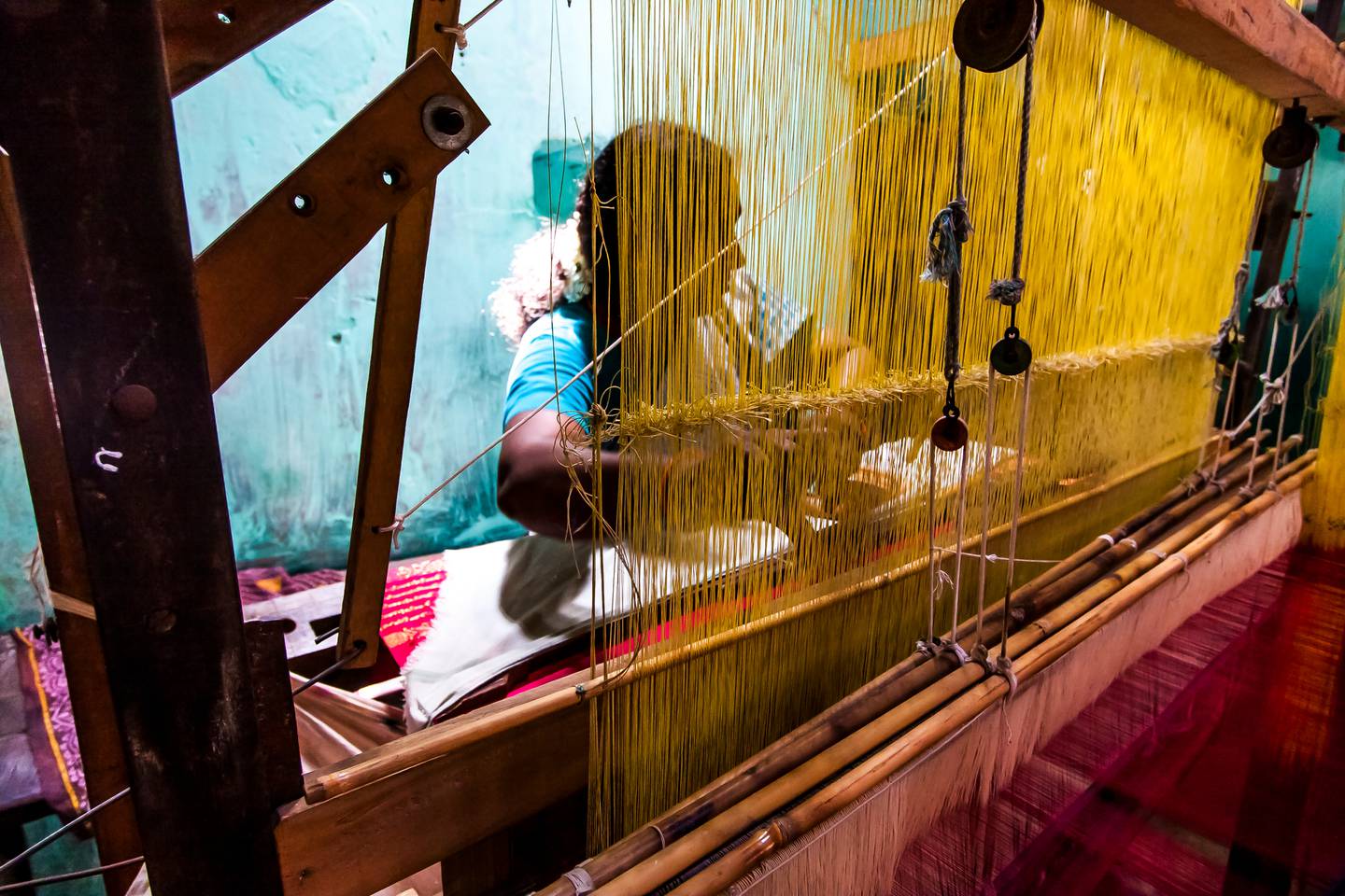 A female weaver works in a Tamil Nadu factory. Shutterstock