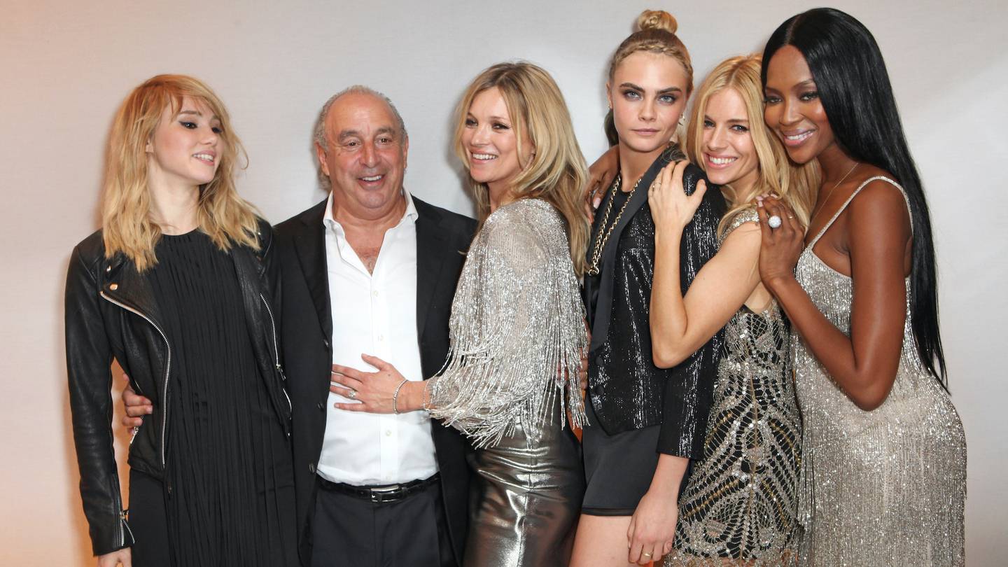(L to R) Suki Waterhouse, Sir Philip Green, Kate Moss, Cara Delevingne, Sienna Miller and Naomi Campbell attend dinner celebrating the new 'Kate Moss for TopShop' collection in 2014 | Source: Getty
