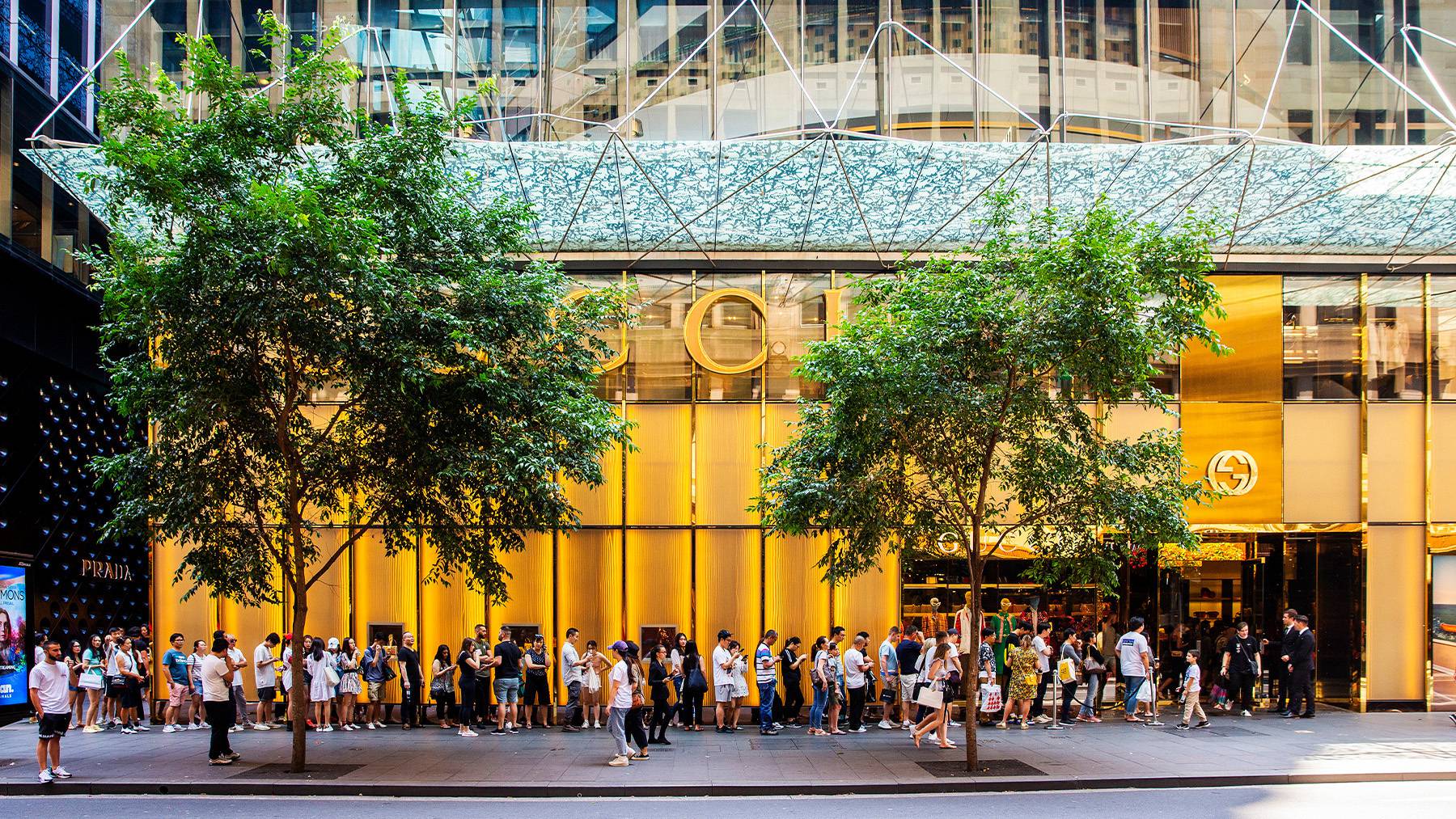 A long queue of shoppers line up outside a Gucci store in Sydney, Australia.