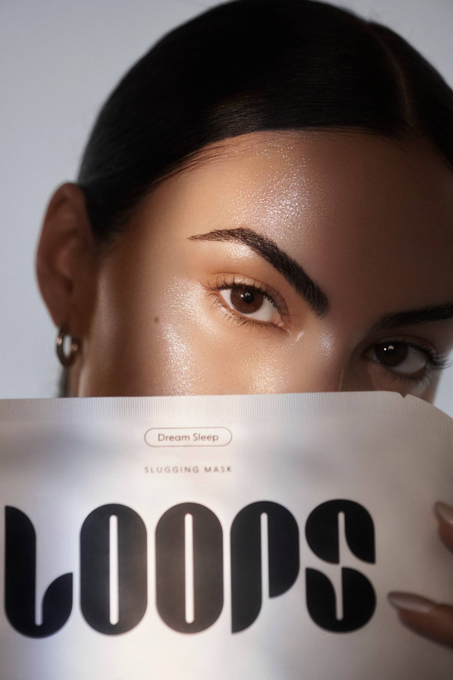 Camila Mendes in an ad for beauty brand Loops Beauty
