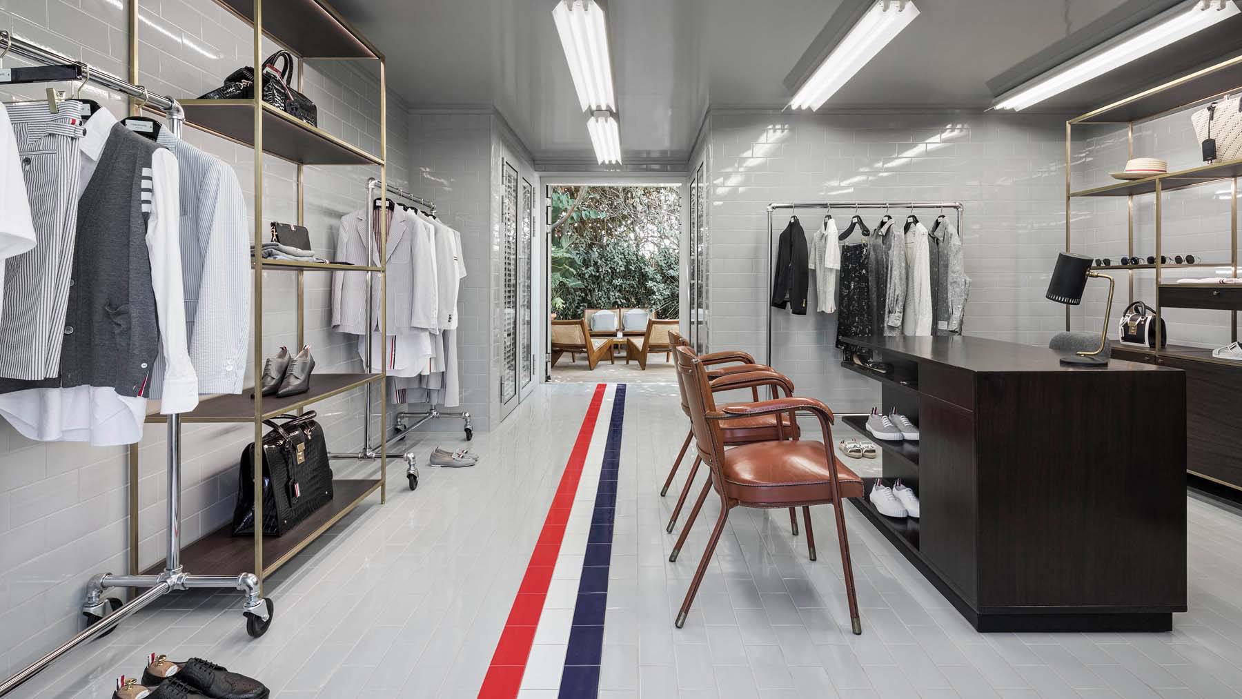 inside thom browne store clothing racks and desk