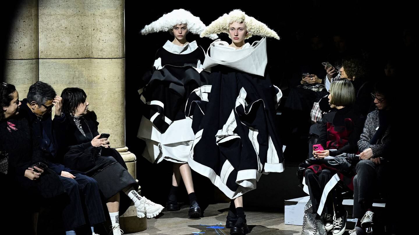 Models walk down the runway at the Comme des Garçons Autumn/Winter 2023 show in Paris.
