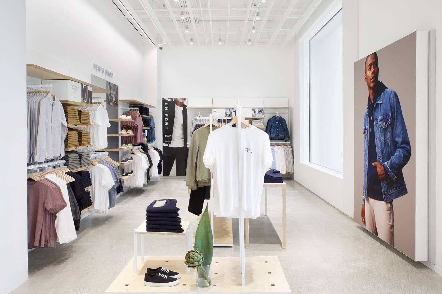 Everlane store in Austin, racks of clothing pieces in solid colors.