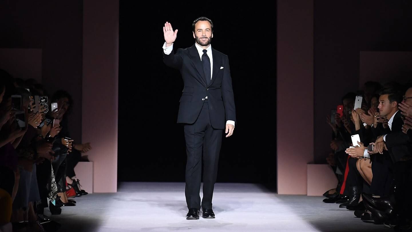Designer Tom Ford waves from the runway following his Tom Ford SS18 show in September 2017 in New York City.