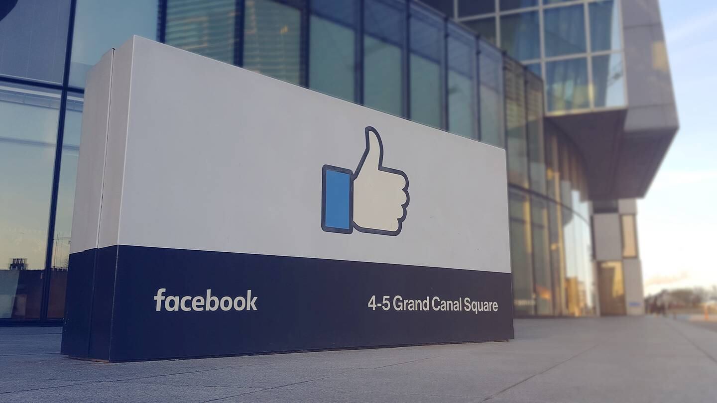 A facebook sign outside an office building.