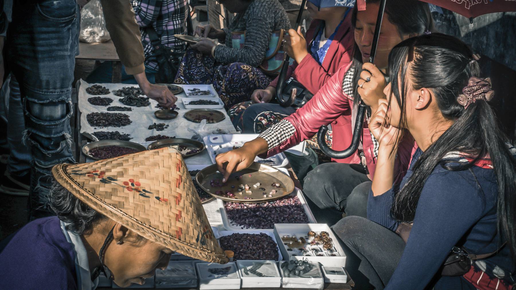 Gem traders at a market in Myanmar in 2015. The world's most prized rubies originate in the country, but the industry's links to the military have made them the subject of sanctions and controversy.