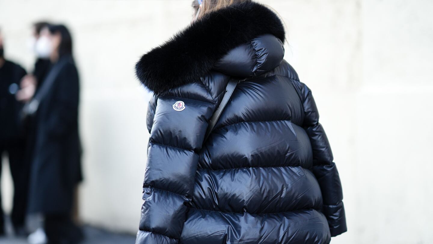 A guest wears a Moncler puffer jacket at Milan Men's Fashion Week on January 15, 2022. Moncler announced it will stop using fur in all products by A/W 2023.