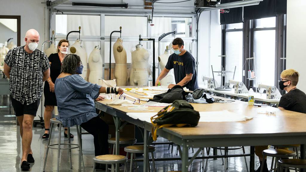 Columbia College Chicago fashion students designing in the studio | Source: Courtesy