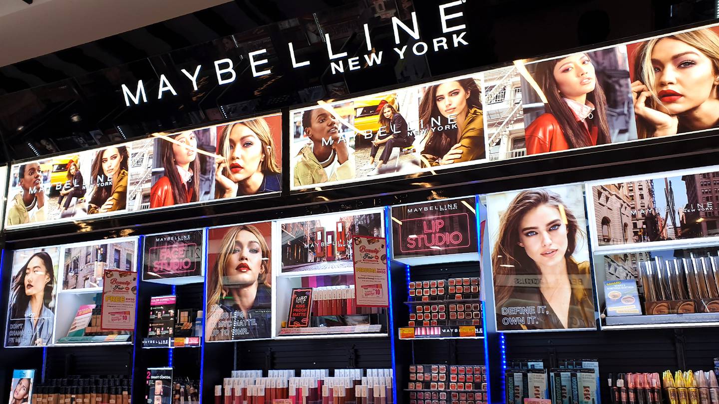 Maybelline New York cosmetics stand in a store.