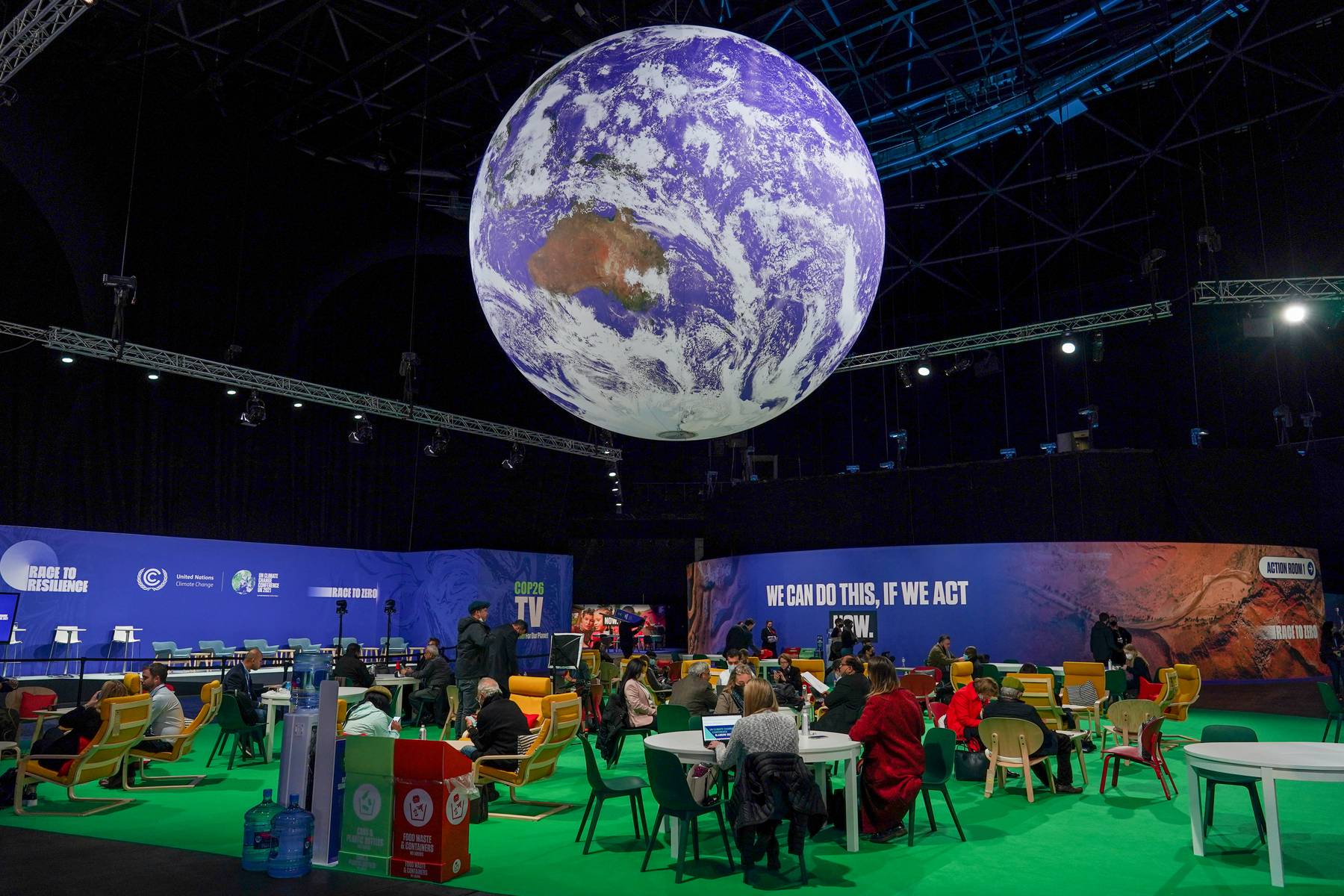 A giant globe hangs from the ceiling as delegates attend the COP26 United Nations Climate Change Conference in Glasgow, Scotland